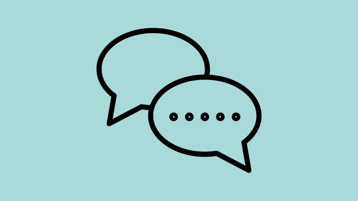 Zwei sich überlappende Sprechblasen, eine leer, die andere mit Punkten, die Text darstellen.
