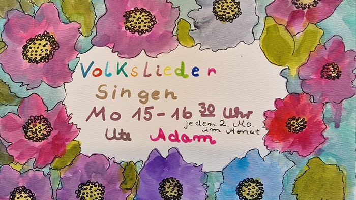 Bunter Blumengarten mit Veranstaltungshinweis auf Volkslieder-Singen