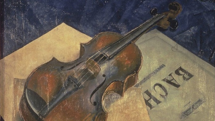 Ein Bild zeigt eine Geige auf einem Notenblatt mit dem Namen Bach