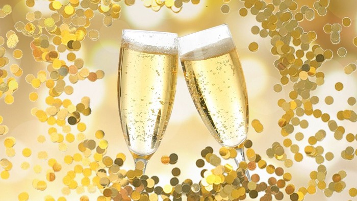 Toast med champagnoglober i glitrende guld.