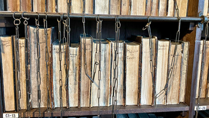 Books hanging from metal bars