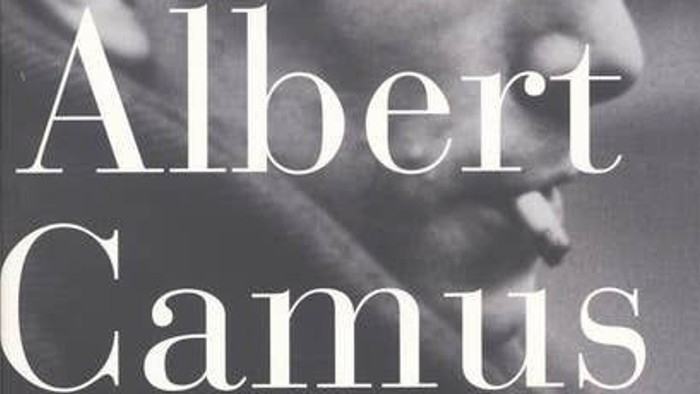 Bogens forside viser et sort-hvidt fotografi af en mands ansigt i profil, og titlen *