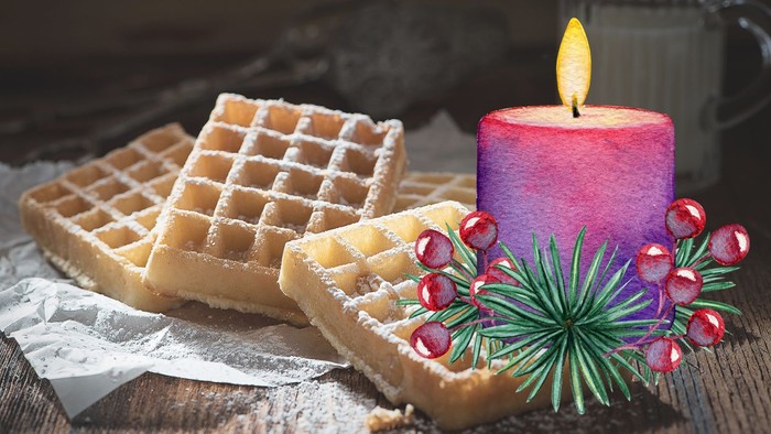 Waffeln auf einem Teller, daneben Grafik mit brennender Kerze und Adventsdeko
