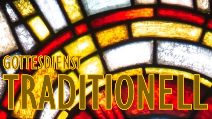 Buntes Kirchenfenster mit dem Wort 