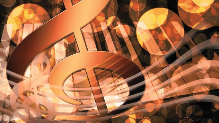 Notenschlüssel und Tasten mit gelben Lichtpunkten