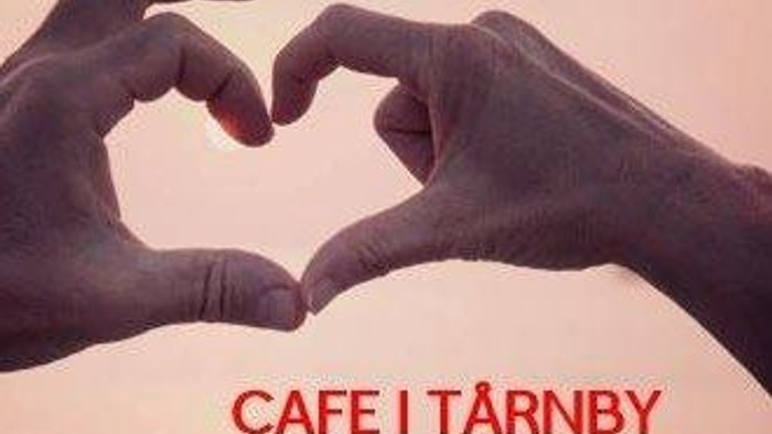 To hands skaber et hjerte, og der står 