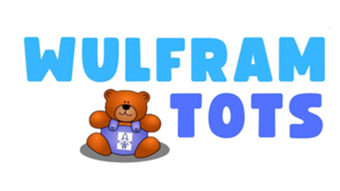 A teddy bear wearing a blue shirt with the text 
