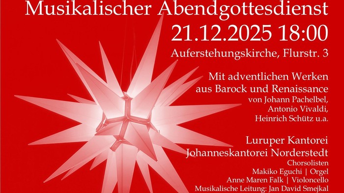 Herrenhuter Stern der Auferstehungskirche vor rot gefärbtem Hintergrund