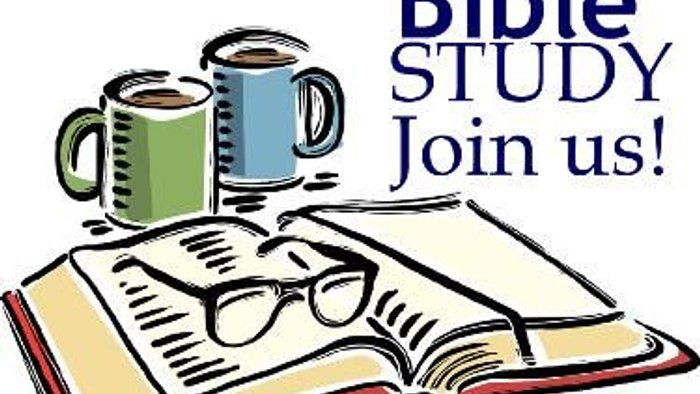 An open book with glasses and coffee cups, inviting Bible study