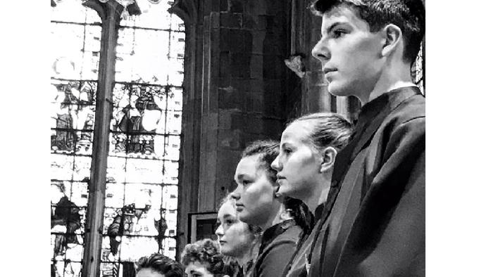 Group of men singing in church.