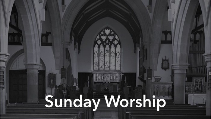 Church interior with pews, stained glass windows, and organ, labeled 