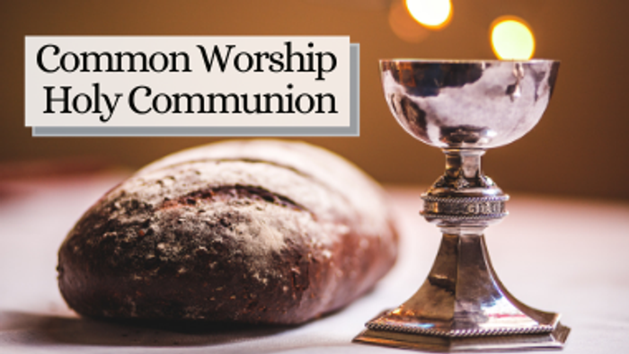 A silver chalice and a loaf of bread, symbolizing Holy Communion