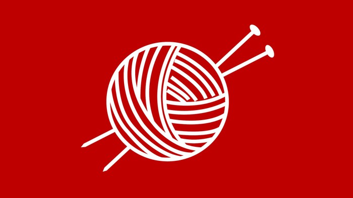 Et hvidt strågulv med to nåle på en rød baggrund