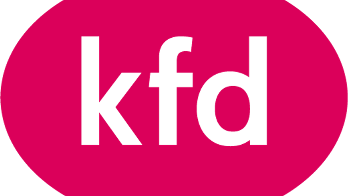 Das Bild zeigt ein ovales, pinkes Schild mit der Aufschrift 