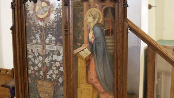 Wooden box with religious painting inside.
