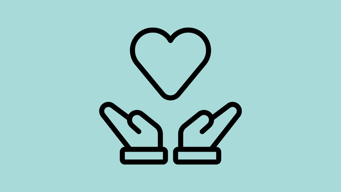 Zwei Hände, die ein Herz halten