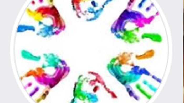 Colorful handprints arranged in a circle.