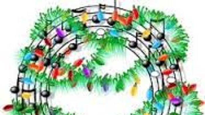 En julekrans med musiknoter og pynt.