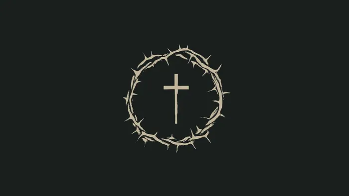 Tornekrans med kors i midten på sort baggrund