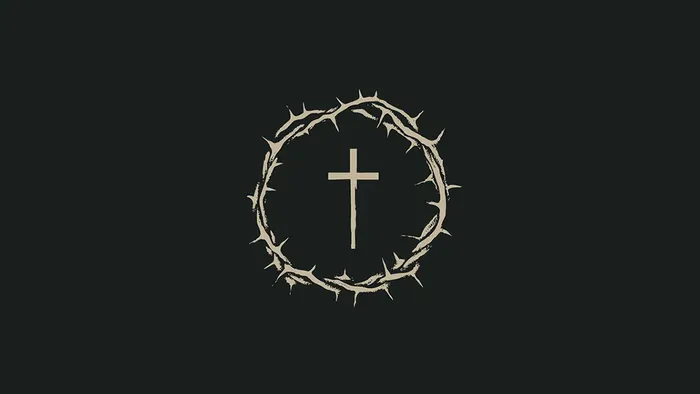 Tornekrans med kors i midten på sort baggrund