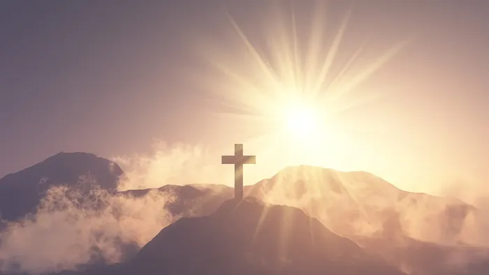 Et kors på bakketop med opstandelsessol