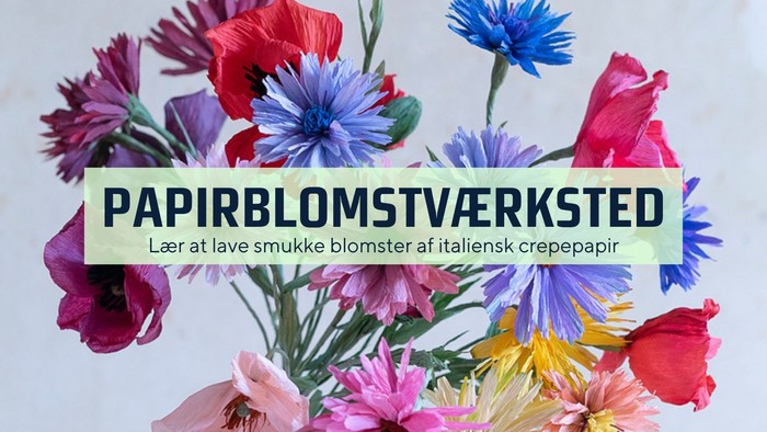 Farverige papirblomster lavet af italiensk kreppapir, der viser et levende paperblomst-værksted.