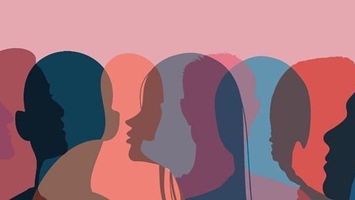 Verschiedene Silhouetten von Menschen, die in Einheit zusammenstehen, in unterschiedlichen, lebendigen Farben.