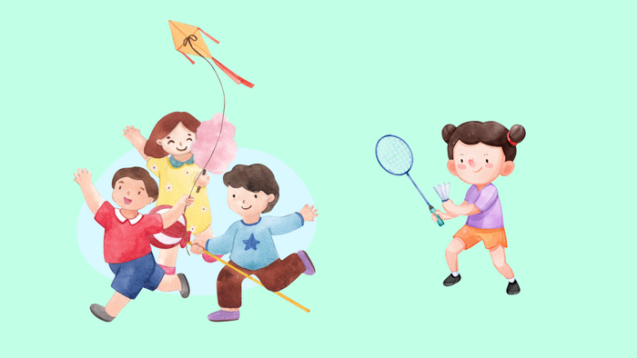 Kinder spielen mit Drachen und Badminton auf einem grünen Feld