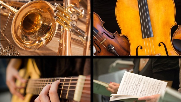 Das Bild zeigt verschiedene Musikinstrumente und Notenblätter