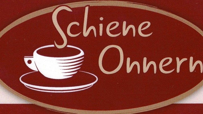Das Bild zeigt ein Kaffeetassen-Logo mit dem Text 
