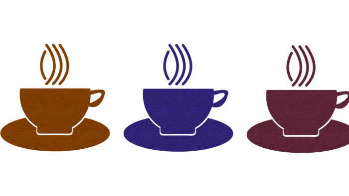 Fire farvefulde tekanoner på sort baggrund