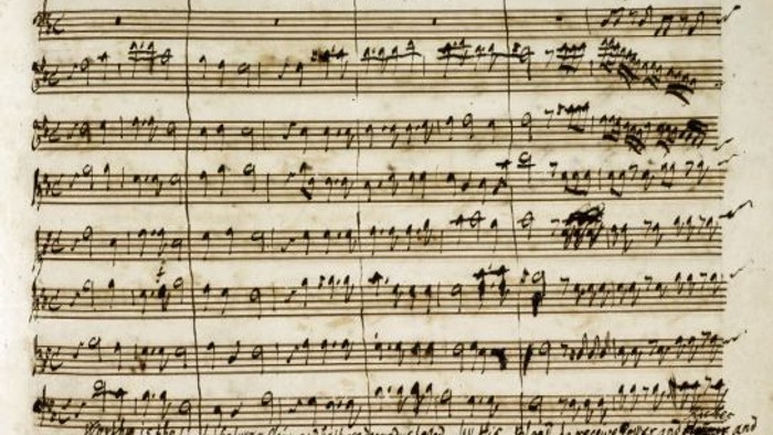 Ein handgeschriebenes Notenblatt mit musikalischer Notation.