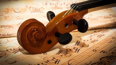 Small desk calendar displaying the number 1, placed on a soft white surface.