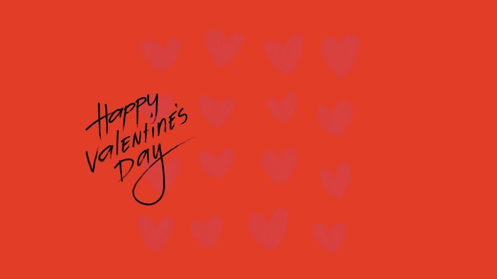 Lebendige rote Valentinstagsgrußkarte mit handgeschriebener „Happy Valentine’s Day“-Botschaft und Herzformen.