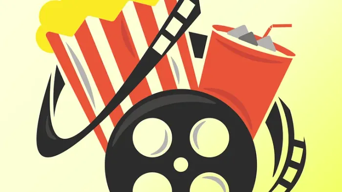 Das Bild zeigt Popcorn, eine Filmrolle und einen Softdrink.