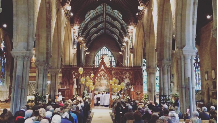 Church interior with congregation attending service