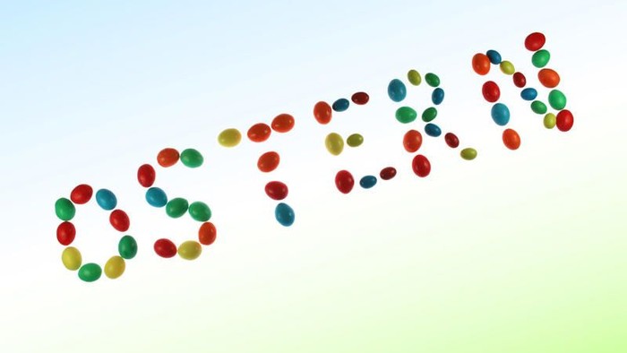 Bunte kreisförmige Perlen, die „STEM“ auf einem Verlaufshintergrund bilden.