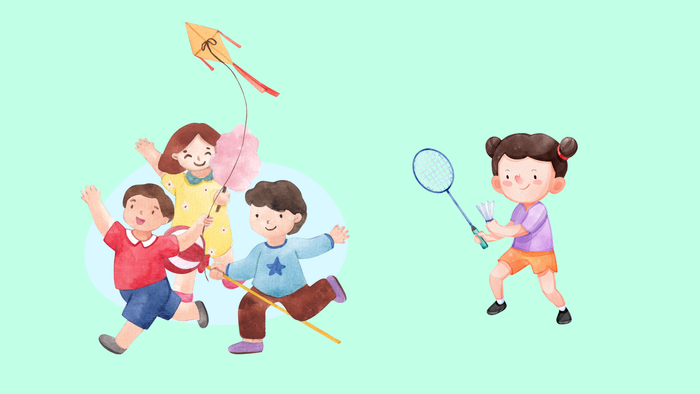 Kinder spielen mit Drachen und Badminton auf einem grünen Feld