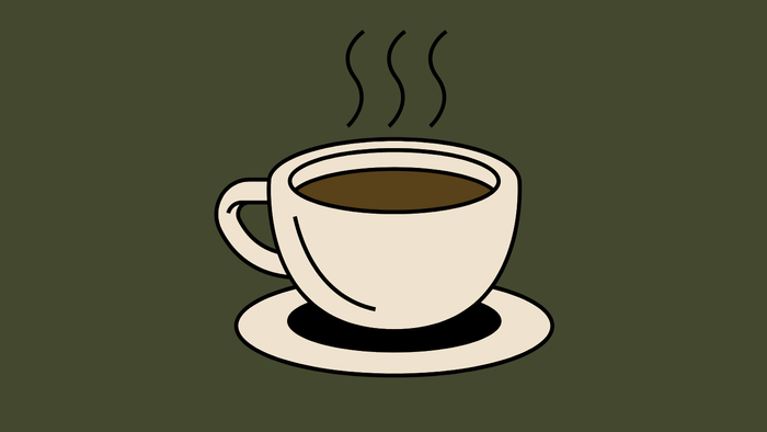 En dampende kop kaffe på en underkop med stigende damp over den.