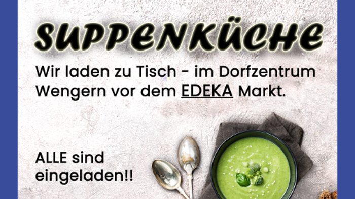 Das Bild zeigt ein Teller Suppe mit Löffeln und Brot.