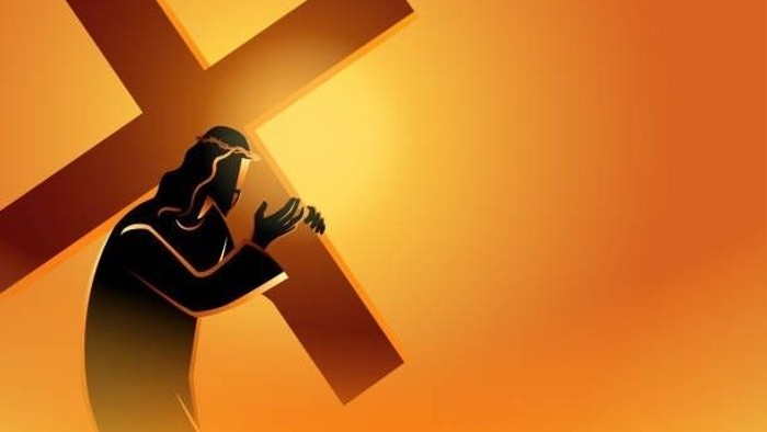Eine Silhouette eines Mannes mit einem Kreuz auf einem orangefarbenen Hintergrund