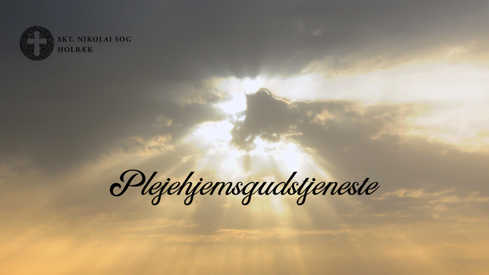 Solnedgang med lysstråler og tekst på dansk