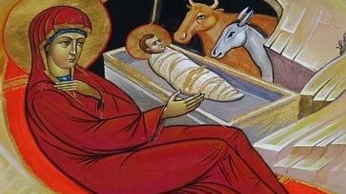 Ein Bild zeigt die Geburt Jesu mit Maria, dem Kind in der Krippe, einem Ochsen und einem Esel.