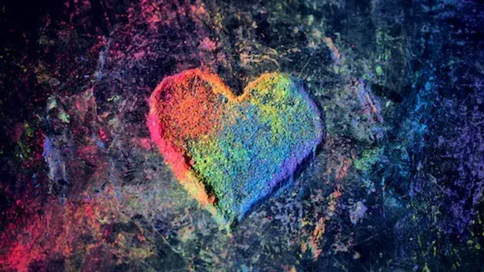 Bunter, leuchtender Herz-Aufkleber auf rauer Oberfläche