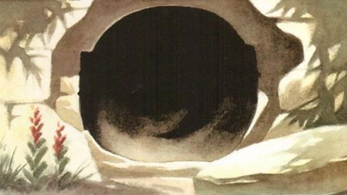 Billedet viser en sort kugle med rød og grøn vegetation i forgrunden