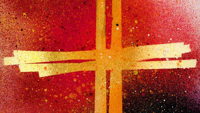 Ein leuchtend gelbes Kreuz vor einem roten und schwarzen Hintergrund