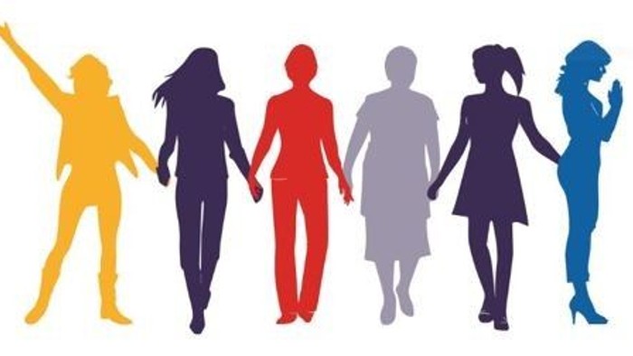 Verschiedene Frauen, die sich in einer Reihe an den Händen halten und Einheit und Solidarität symbolisieren.