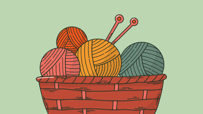 En korbund med garnspindler og strå, omgivet af forskellige sy- og stråknuder.