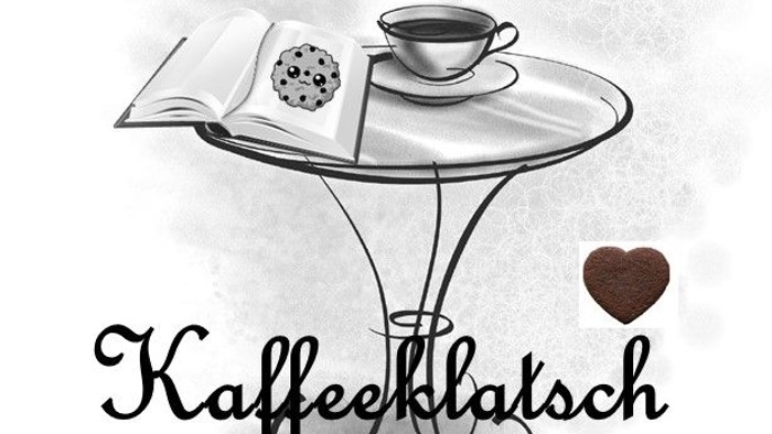 Ein Kaffeetisch mit Buch, Keks und dampfender Tasse, Herz und 