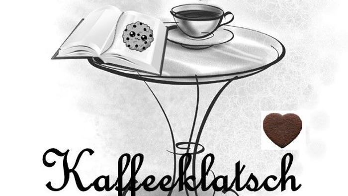 Ein Kaffeetisch mit Buch, Keks und dampfender Tasse, Herz und 